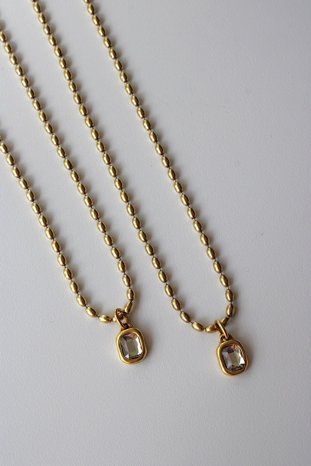 Bezel Crystal Necklace in Antique Gold
